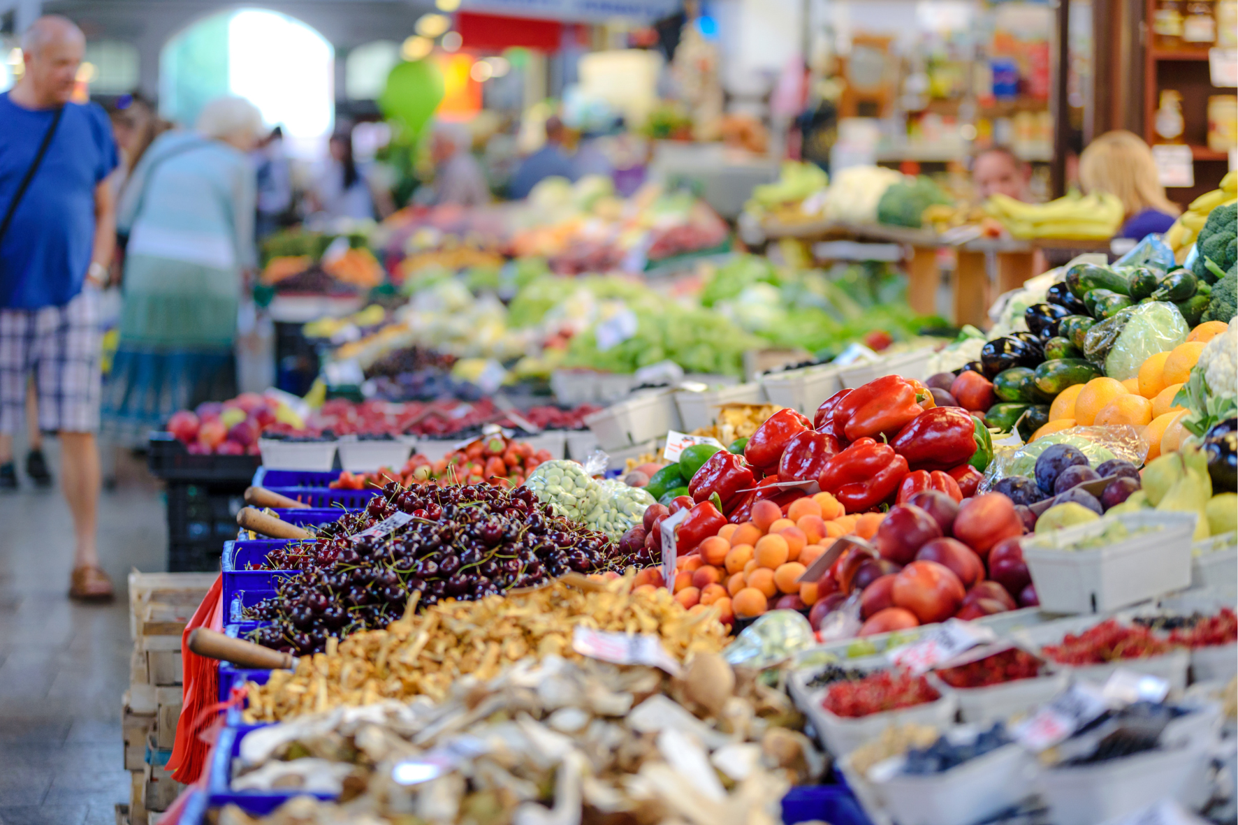 a group of fruits and vegetables in a market